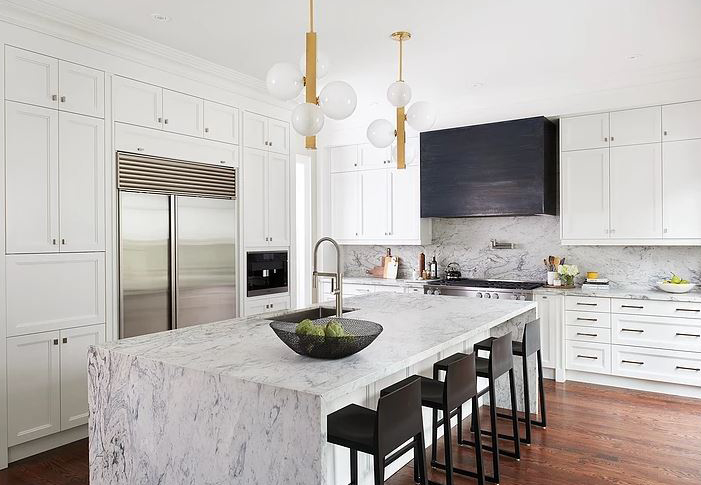 White kitchen with marble slab backsplash